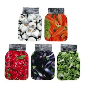 May include: Six mason jars with silver lids filled with different vegetables. The jars are filled with garlic, carrots, radishes, aubergines, broccoli, and green beans.