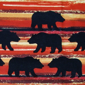 May include: Fabric featuring a repeating pattern of black bear silhouettes against a backdrop of horizontal stripes in red, orange, and brown. The bears are uniformly spaced across the material.