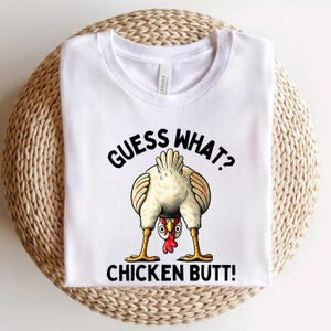 Guess What? Chicken Butt! Funny Unisex T-Shirt, Perfect for Laughter & Casual Wear! Hilarious Chicken Humor Tee for Adults and Kids