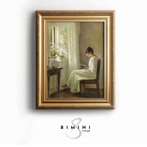 May include: A framed painting of a woman in a white dress sitting in a chair and reading a book. The painting is set in a room with a window and a plant in the corner.