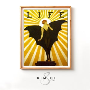 May include: A vintage LIFE magazine cover featuring a woman with wings standing on a platform against a yellow sunburst background. The magazine title "LIFE" is printed in black at the top of the cover.