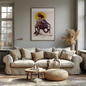 May include: A framed print of a vintage illustration depicting two children seated on a bench, with a dog. The artwork features a warm color palette with a yellow sun in the background. The print is displayed above a beige sofa in a living room setting.