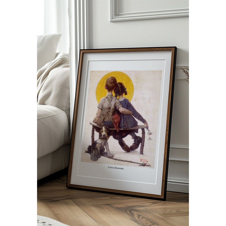 May include: Framed print of a classic illustration featuring two children sitting on a bench with a dog. The artwork has a warm color palette with a yellow sun in the background. The text "Little Spooners" is at the bottom.