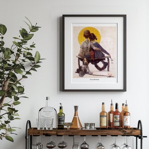 May include: Framed print of a vintage illustration depicting two children sitting on a bench with a dog. The artwork features a yellow sun in the background and is titled "Little Spooners". The frame is black.