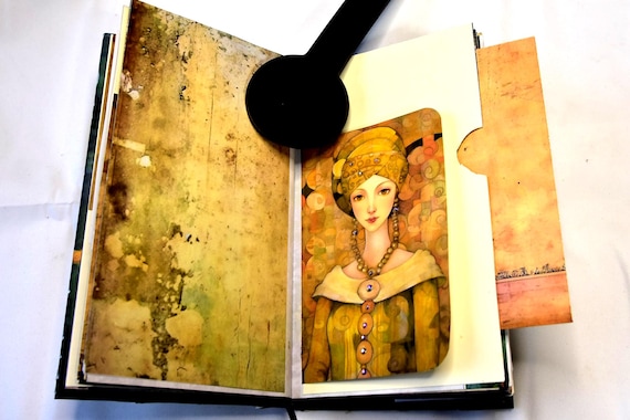 A one-of-a-kind Victorian fantasy junk journal stuffed with antique ephemera — handmade, tactile, and the kind of thing you can't find anywhere else.