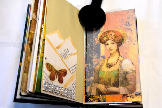 A one-of-a-kind Victorian fantasy junk journal stuffed with antique ephemera — handmade, tactile, and the kind of thing you can't find anywhere else.