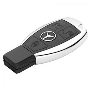 May include: A silver and black car key with four buttons. The key has a Mercedes-Benz logo on it.