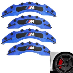 May include: Set of four blue brake caliper covers featuring a black and white BMW logo. The covers are designed to fit over the brake calipers and add a sporty look to the car.