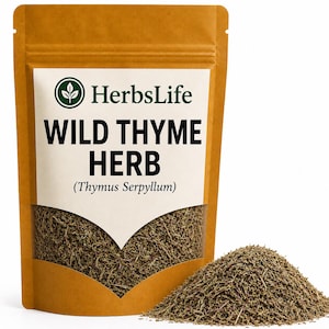 May include: A brown stand-up pouch containing dried wild thyme herb. The label features the text HerbsLife, WILD THYME HERB, and (Thymus Serpyllum) above a clear window showing the green-brown dried herb. A pile of the herb sits to the right.