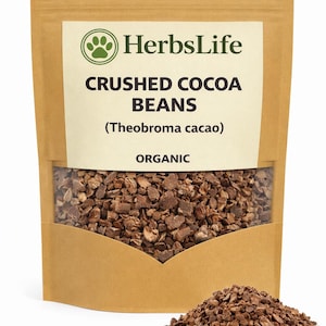 May include: A brown paper bag with a clear window showing crushed cocoa beans. The bag is labelled with "HerbsLife" and "CRUSHED COCOA BEANS (Theobroma cacao) ORGANIC". A small pile of crushed cocoa beans is in front of the bag.