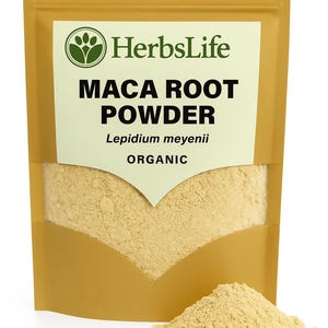 May include: A golden pouch of HerbsLife Maca Root Powder. The pouch has a white label with the brand name and product information. A small pile of the powder sits in front of the pouch. The product is labelled as organic.