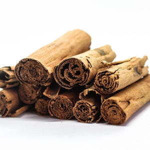 Close-up of Ceylon cinnamon sticks, aromatic botanical bark