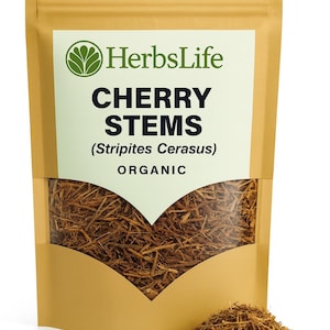 May include: A tan pouch with a clear window showing dried cherry stems. The label reads "HerbsLife CHERRY STEMS (Stripites Cerasus) ORGANIC". A small pile of stems is in front of the pouch.