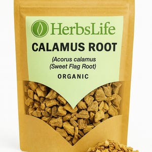 May include: A brown paper bag with a clear window displaying Calamus Root. The bag has a green label with the text "HerbsLife CALAMUS ROOT (Acorus calamus (Sweet Flag Root)) ORGANIC". A small pile of the root is visible.
