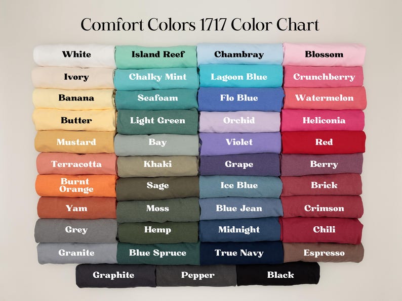 May include: Color chart displaying a variety of Comfort Colors 1717 t-shirt shades. The chart includes colors like white, black, blue, green, orange, and pink, with each color labeled for easy reference. The text "Comfort Colors 1717 Color Chart" is at the top.