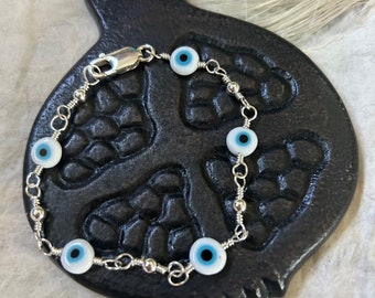 White and Light Blue Glass Evil Eye Beads and Sterling Silver Bracelet