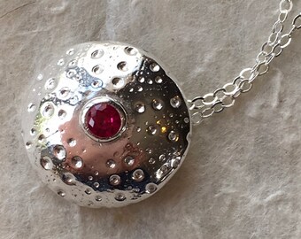 Round Fine Silver Textured Pendant with Red Corundrum