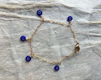 Tiny Blue Eye Bead Bracelet - 7.5” on gold fill chain