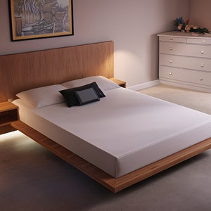 May include: A wooden platform bed frame with a white mattress and two pillows. The headboard is made of wood and has a built-in bedside table on the left side.