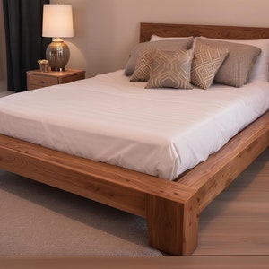 May include: A wooden platform bed frame with a white mattress and beige pillows. The bed is made of solid wood and has a simple, modern design.