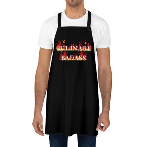 May include: A black apron with adjustable straps and a white text design that reads "CULINARY BADASS" with flames behind the text.
