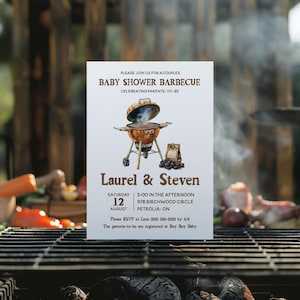 May include: A white invitation card for a baby shower barbecue. The card features a watercolor illustration of a grill with smoke, text that reads "Baby Shower Barbecue", and the names "Laurel & Steven". The date and location are also included.