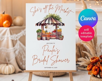 Puede incluir: Un letrero blanco sobre un caballete con el texto "She's off the Market" y "Paula's Bridal Shower". El letrero presenta una ilustración de acuarela de un puesto de mercado con frutas y verduras. También es visible la fecha "18 de septiembre de 2029".
