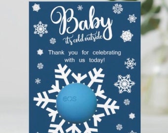 Baby it's cold outside themed baby shower EOS lip balm favors, navy blue, white, snowflakes, winter, thank you for celebrating with us, gift