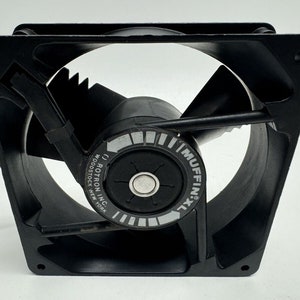 May include: A black computer fan with a white label that reads "MUFFIN XL" and "ROTRON INC. WOODSTOCK NEW YORK".
