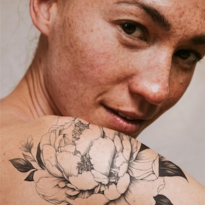 Elegant Peony Tattoo, Monochrome Floral Tattoo, Artistic Tattoo Design, Black Ink Tattoo, Hand-Drawn Tattoo, Detailed Illustration Tattoo