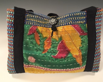 Handwoven handsewn handbag with kantha cloth exterior pockets