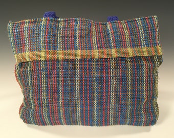 Handwoven handsewn handbag made with recycled plastic bags and jeans
