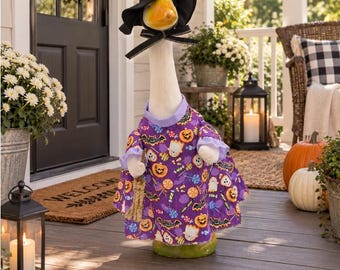 Halloween witch outfit in purple with designs in ghosts pumpkins bats candy with handmade witch hat and broom