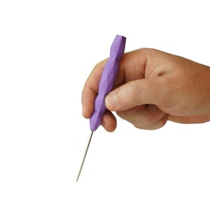 May include: A craft tool featuring a light purple handle with a faceted, geometric design and a thin, pointed metal tip. The handle has a textured, multi-sided shape that tapers toward the metal needle, providing a grip for detailed work.