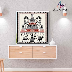 May include: Black and white illustration of a traditional Indian folk art design. The artwork features a central figure with a red and black pyramid shape above them. The figure is surrounded by trees and animals. The artwork is framed in a white frame.