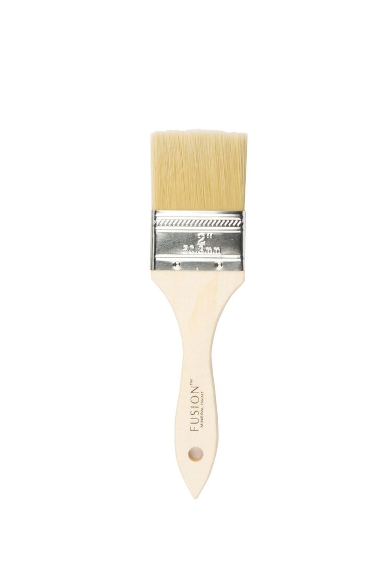 May include: A 2-inch wide, natural bristle paint brush with a wooden handle. The handle is labeled "FUSION&trade; MINERAL PAINT".