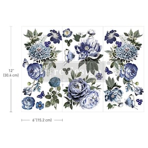 May include: A sheet of blue and white floral transfer decals for furniture and home decor. The decals feature a variety of blue flowers, including roses, peonies, and hydrangeas, with green leaves and butterflies. The sheet measures 30.4 cm by 15.2 cm.