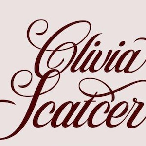May include: The text Olivia Scatcer is written in a dark maroon, elegant, cursive script font. The letters feature decorative flourishes and loops, set against a solid, light-colored, pale pinkish-beige background. The typography is centered.