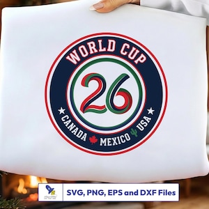 May include: A white graphic featuring a circular design for the World Cup 26. The design includes the text "WORLD CUP 26" and the names of the host countries: Canada, Mexico, and USA. The design is in red, green, and blue.