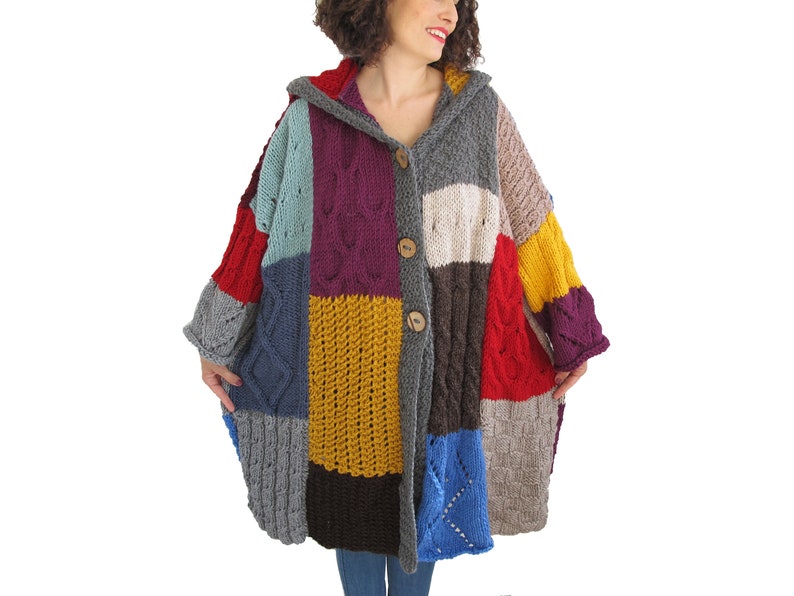 May include: A colorful patchwork knitted cardigan with a hood and button closure. The cardigan is made of different colored yarn, including red, blue, yellow, green, and purple.