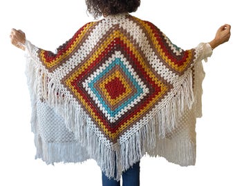 Hand knitted fringed poncho for plus size women, angora wool blend, lightweight and warm, oversized fit L–5XL, perfect winter layering.