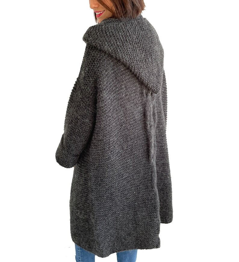 May include: A long, dark gray hooded cardigan sweater with a tie at the back.