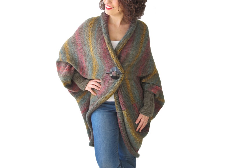 May include: A long, striped cardigan with a shawl collar and a button closure. The cardigan is made of a soft, knitted fabric and is available in a variety of colours.