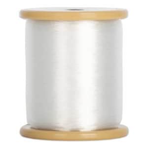 May include: A spool of white thread with a subtle sheen. The thread is tightly wound around a light brown spool. The spool has a cylindrical shape with a flat top and bottom. Ideal for sewing, embroidery, and crafting projects.