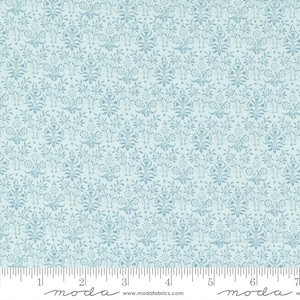May include: Light blue fabric with a repeating floral pattern. The design features stylized flowers and leaves in a darker shade of blue against a lighter blue background. The fabric is measured in inches.