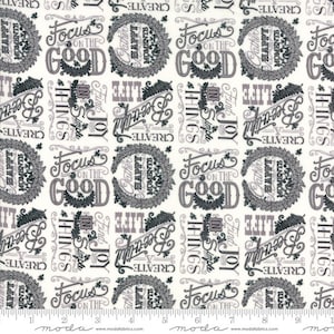 May include: Off-white fabric with a repeating pattern of inspirational words and phrases in gray and black. The design includes phrases like "Focus on the Good," "Create Beautiful Things," and "Gather Happy Moments."