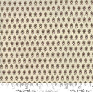 May include: Cream-colored fabric with a repeating pattern of stylized floral motifs in shades of brown and burgundy. The flowers are arranged in a grid-like formation, creating a dense and visually appealing texture. A ruler is at the bottom of the image.