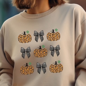Cheerleader Coquette Halloween Sweatshirt, Leopard Pumpkin Graphic, Pumpkin Patch Attire, Athletic Sports Sweater, Spooky Creepy Outfits Gal