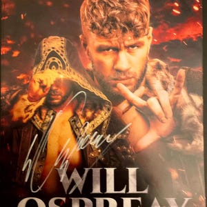 May include: A promotional poster featuring Will Ospreay. The image shows a portrait of a man with a beard and short, curly hair, with a second image of the same man wearing a hooded jacket. The poster includes the name "WILL OSPREAY" in large, bold letters, and a signature.