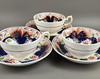 Victoriaans opzichtig Welsh patroon 19e-eeuwse theekop en schotel set van 3. Verzamelobject. Antiek.